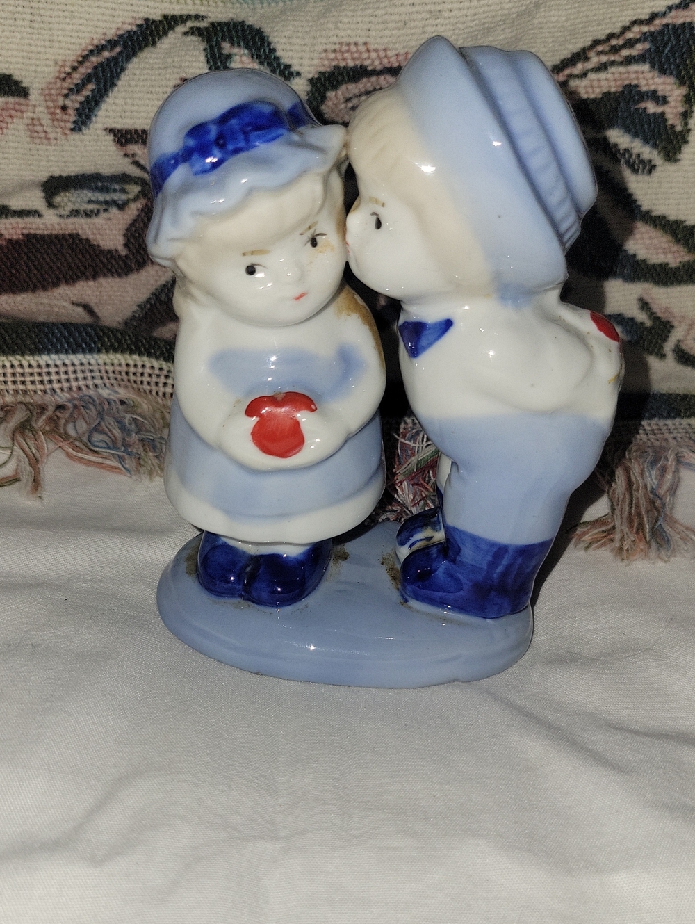Blue and White Ceramic Kissing Children Figurine with Red Heart Accent
